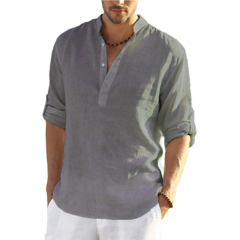 Man wearing a gray short-sleeve shirt on a white background