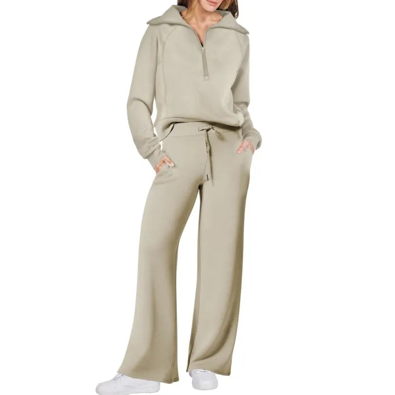 Beige tracksuit worn by a person on a white background