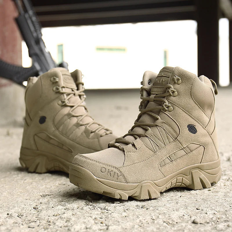 Tan tactical boots on a concrete floor with a blurred background