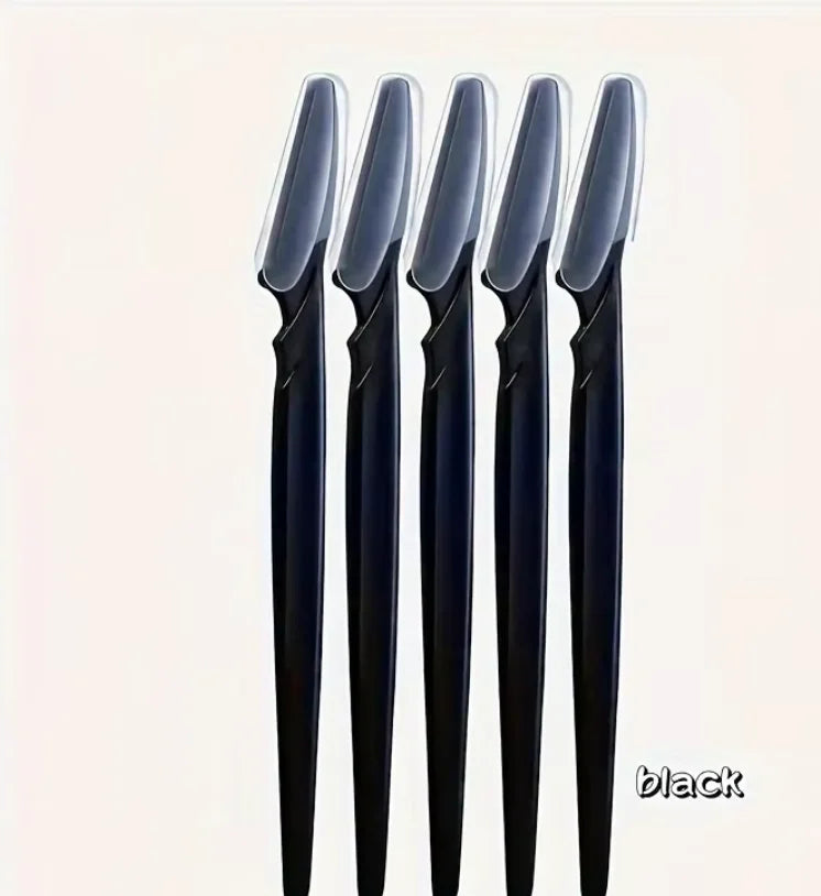 Five black makeup brushes with clear bristles on a light beige background.