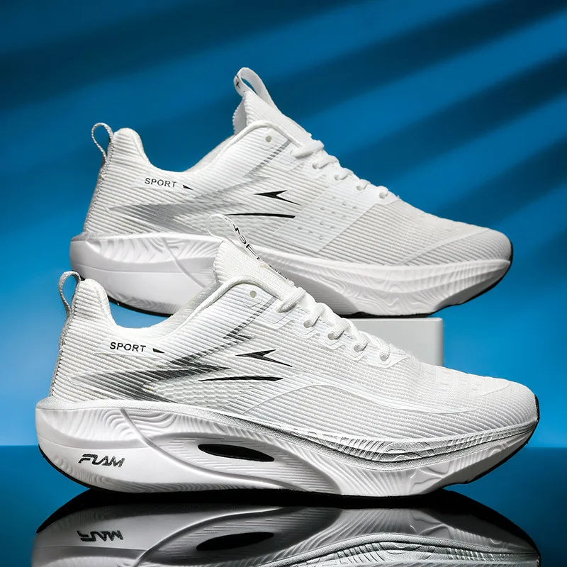White athletic shoes with black text on a blue reflective surface