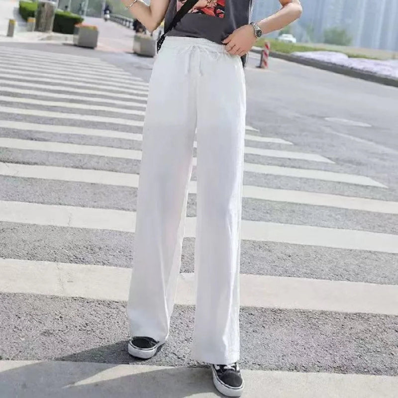 Women’s ankle‑length ice silk wide‑leg pants with elastic waist in solid color white