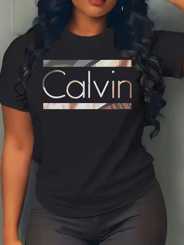 Person wearing a black t-shirt with 'Calvin' printed on it.