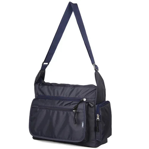 Navy blue shoulder bag with multiple pockets on a white background