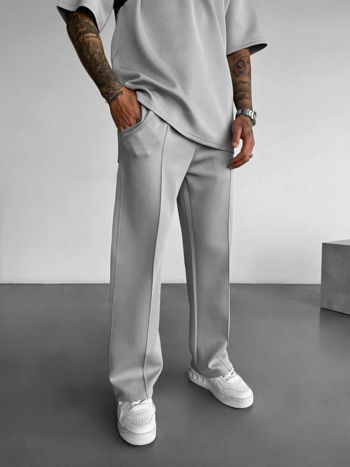 Men’s casual solid-color pants with elastic waist, drawstring closure, and side pockets gray