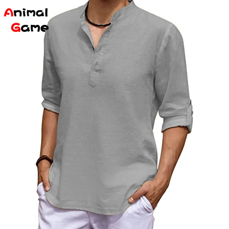 Person wearing a gray long-sleeve shirt with a brand name visible