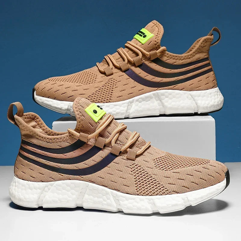 Beige running shoes with white soles on a blue and gray background