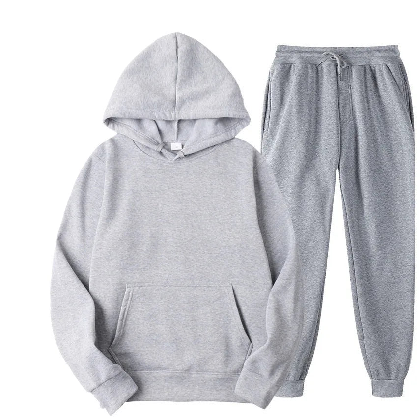 Gray hoodie and pants set on a white background