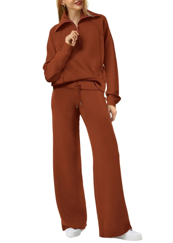 Brown tracksuit worn by a person on a white background
