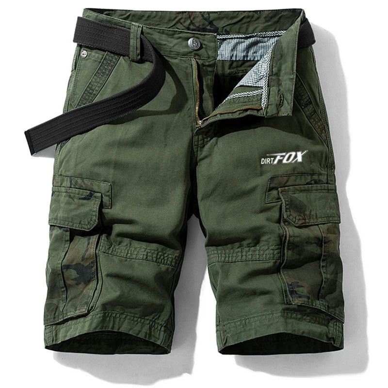 Green cargo shorts with multiple pockets and a belt on a white background