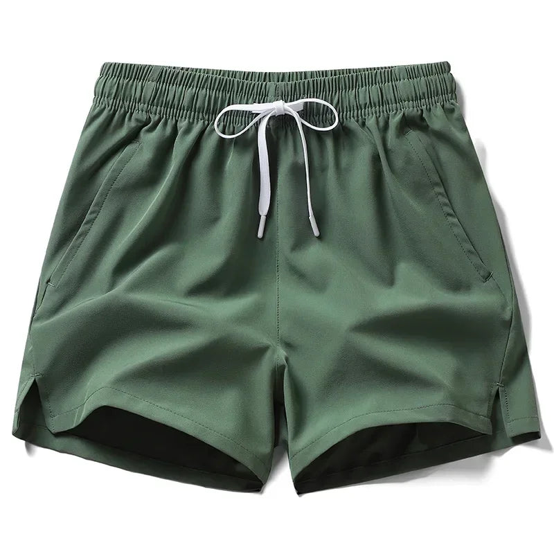 Green shorts with a drawstring on a white background