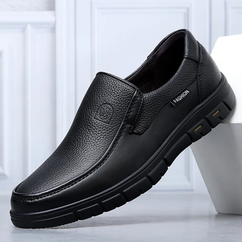 Black leather shoe on a white background