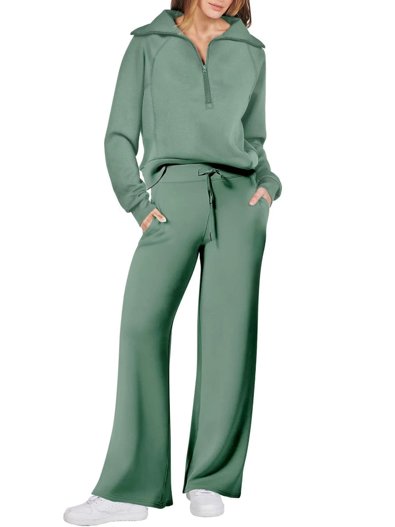 Green tracksuit worn by a person on a white background
