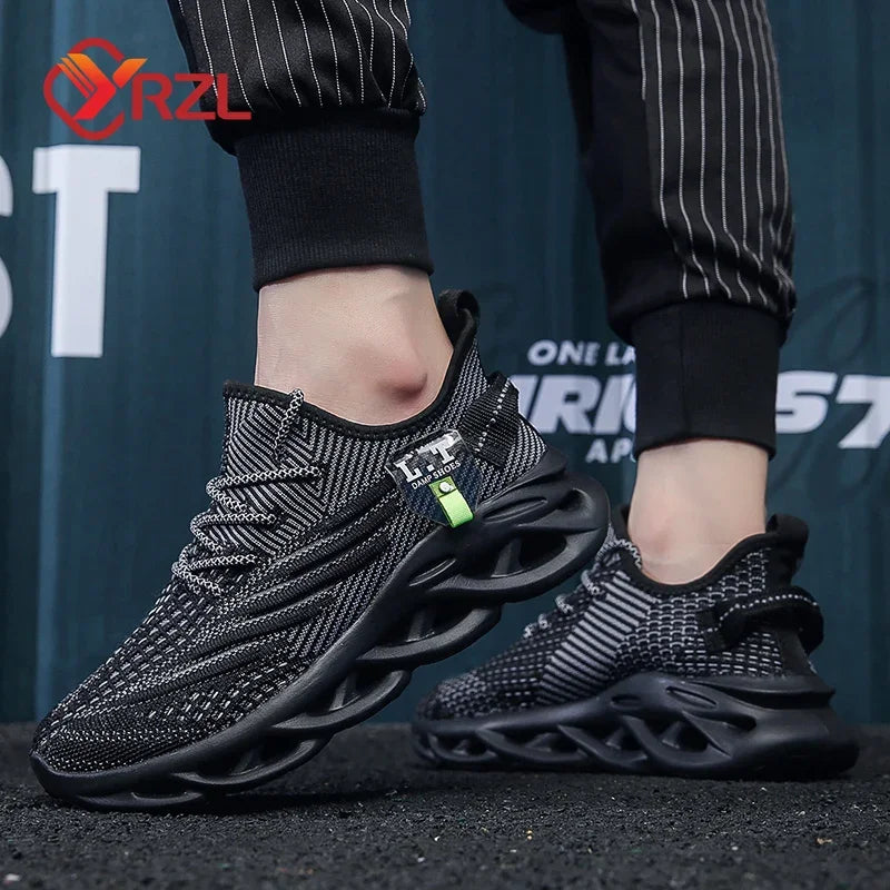 Black and gray sneakers with a unique design worn by a person against a blurred background.