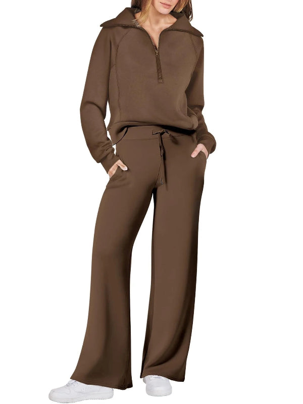 Brown tracksuit worn by a person on a white background