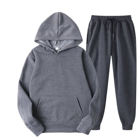 Gray hoodie and pants set on a white background