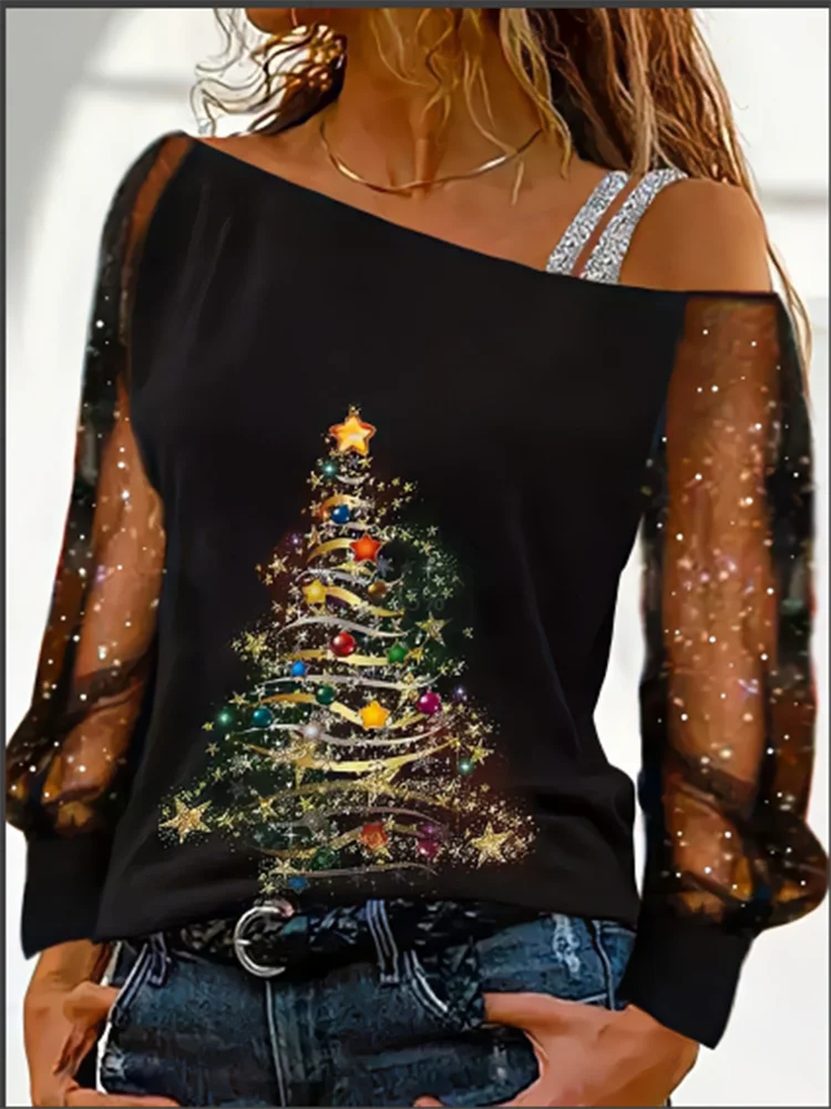 Black top with a colorful Christmas tree design on a blurred background