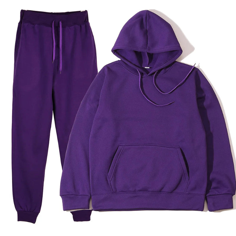 Purple hoodie and jogger pants set on a white background
