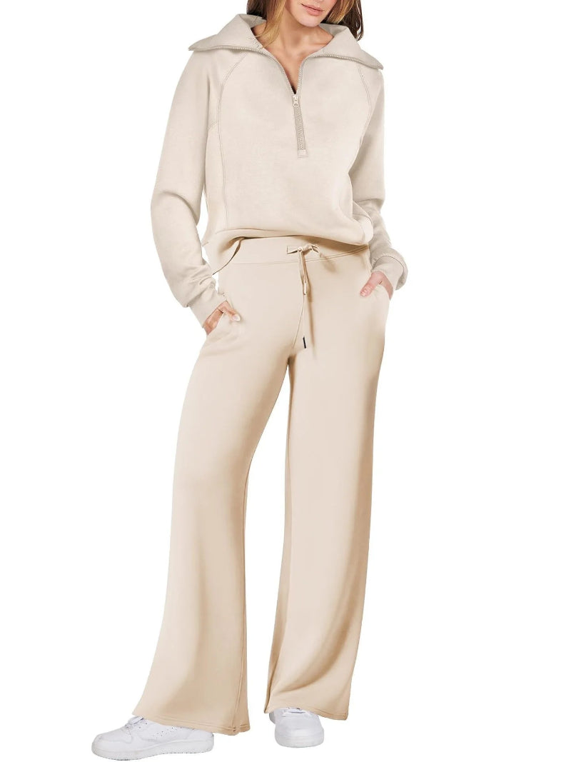 Beige tracksuit worn by a person on a white background