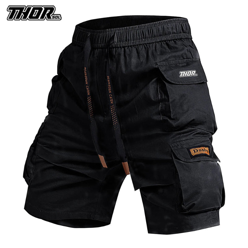 Black cargo shorts with multiple pockets and 'Thor' branding on a white background