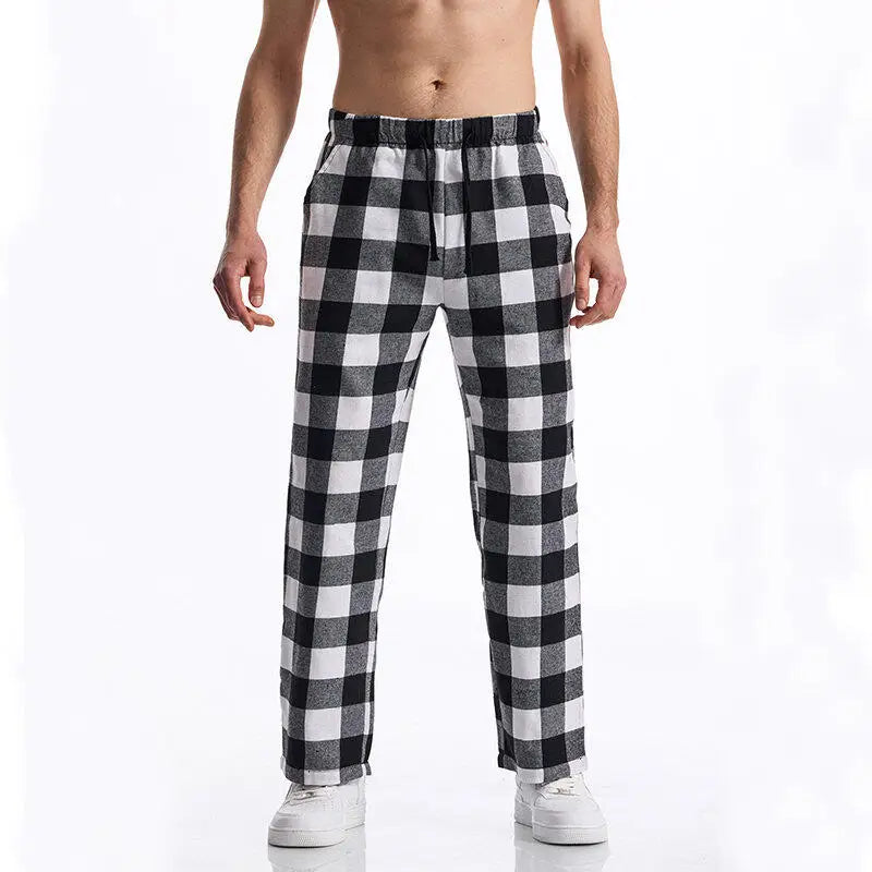 Black and white checkered pants worn by a person on a white background