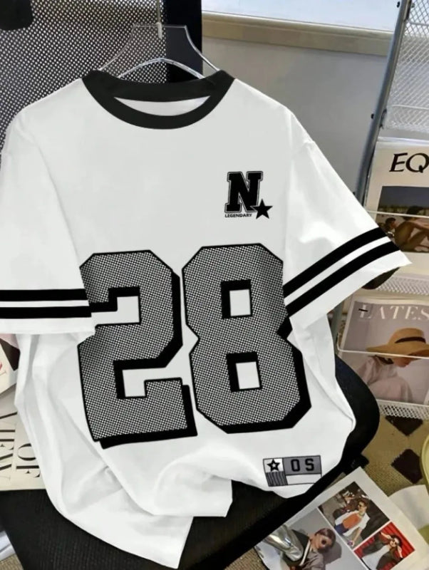 White t-shirt with black lettering and numbers on a table