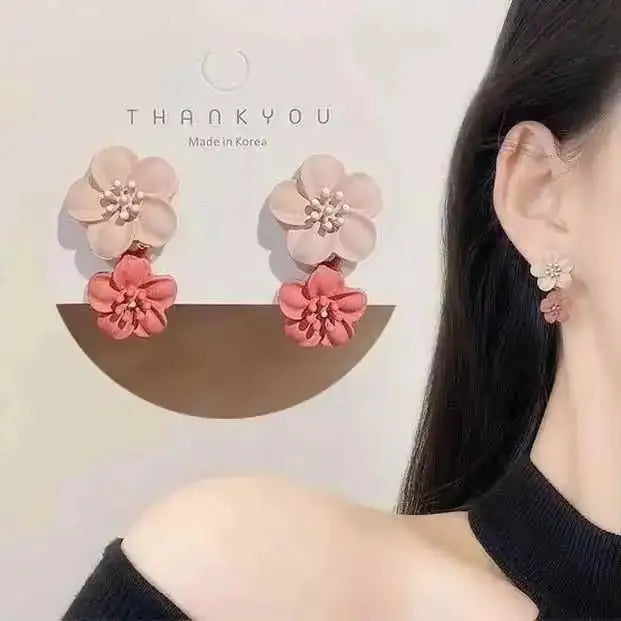 Floral earrings worn by a person with 'THANKYOU Made in Korea' text above.