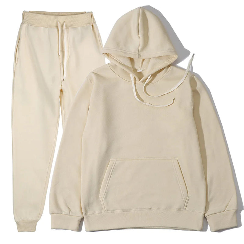 Beige hoodie and pants set on a white background