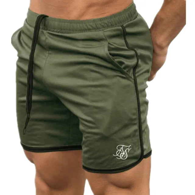 Green athletic shorts with black trim on a white background