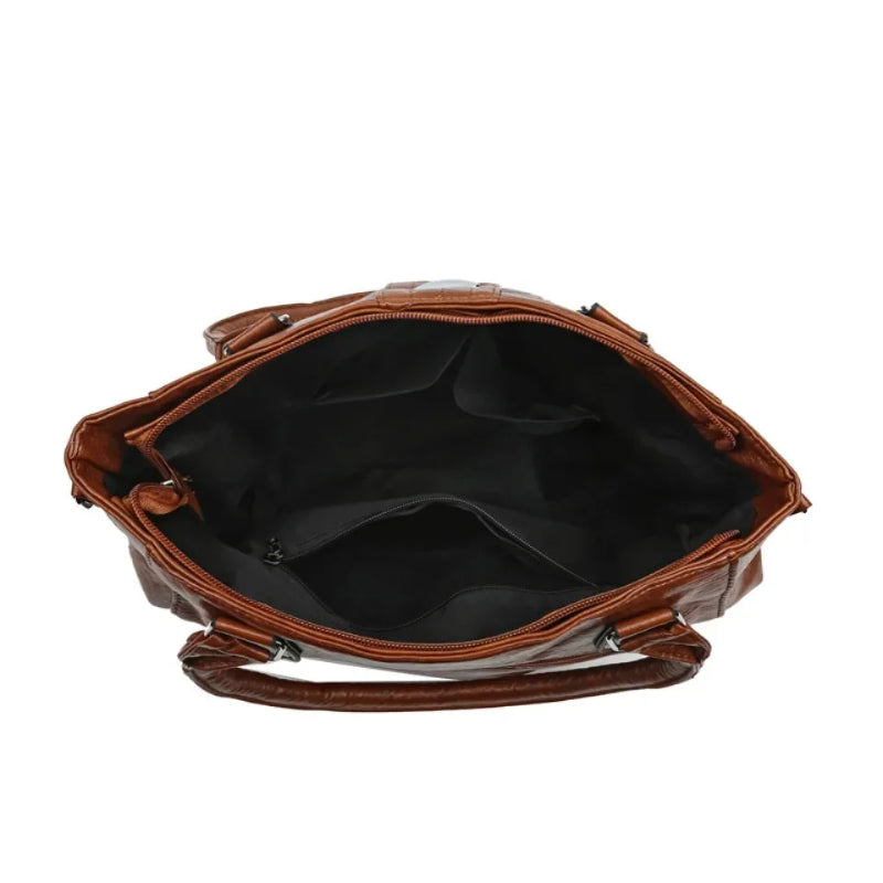 Brown leather handbag on a white background