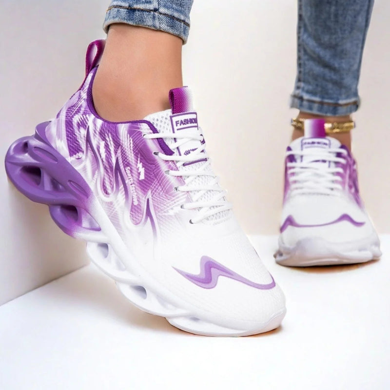 White sneakers with purple accents worn by a person on a light background