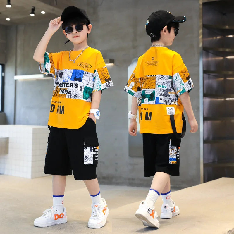 Child wearing a yellow and black outfit with graphic designs in an indoor setting