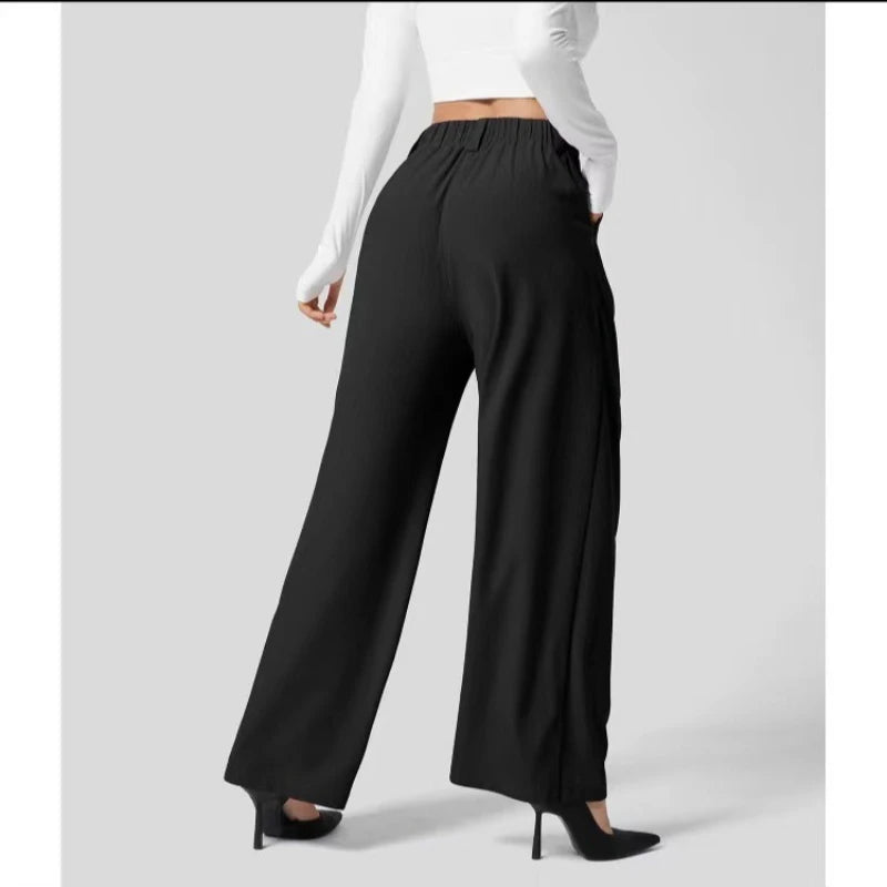 Black wide-leg pants worn by a person on a light gray background