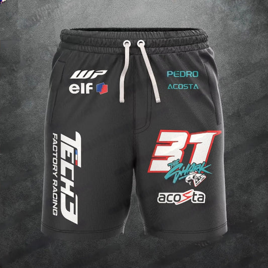 Black shorts with various logos on a dark gray background