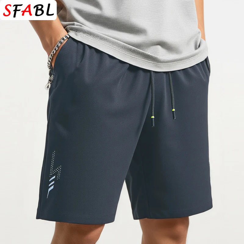 Navy blue shorts with a drawstring on a white background, featuring the brand 'SFABL'.