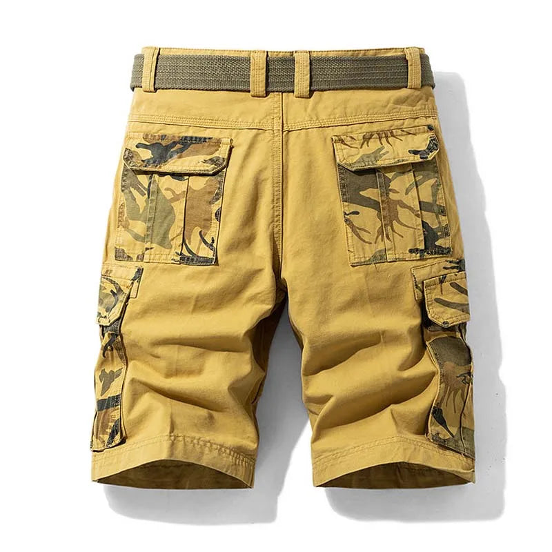 Yellow cargo shorts with camouflage pockets on a white background