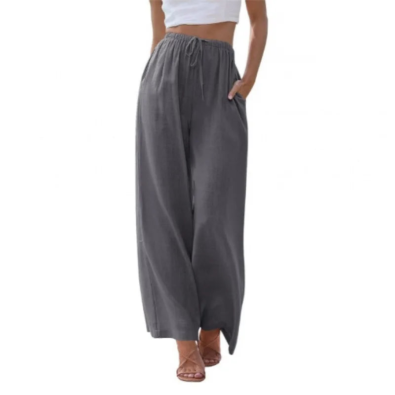 Gray wide-leg pants worn by a person on a white background
