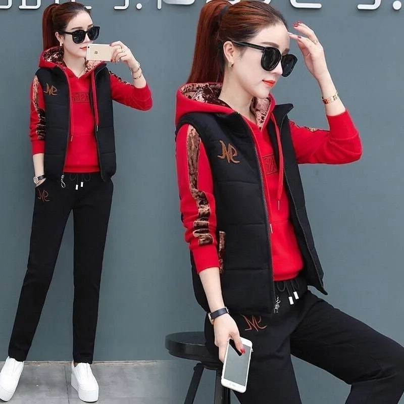 Woman wearing a red and black outfit with a logo, posing against a gray background.