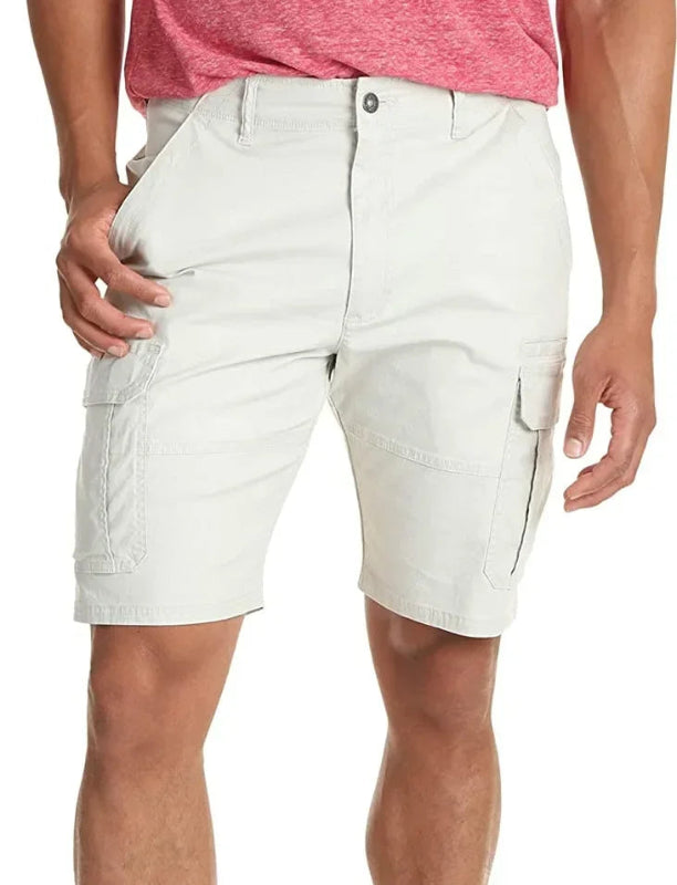 White cargo shorts worn by a person on a white background