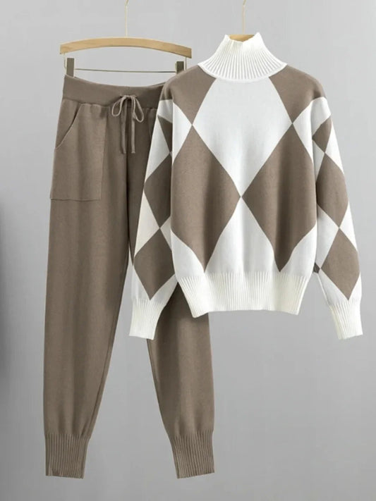 Brown and white argyle sweater with matching pants on hangers against a gray background