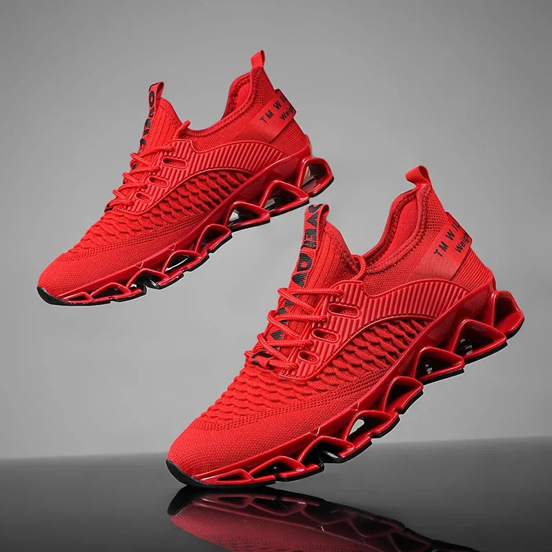 Red athletic shoes on a reflective gray surface with a gradient background