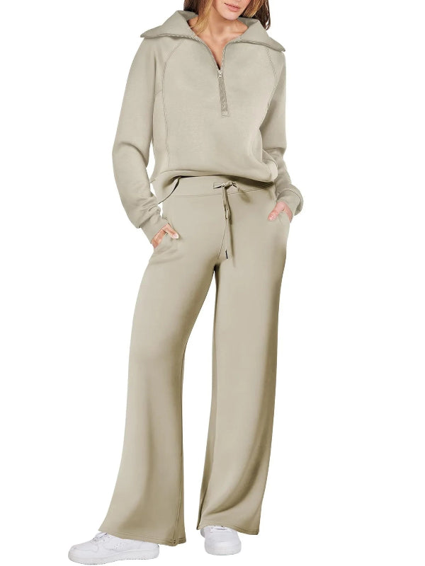Beige tracksuit worn by a person on a white background