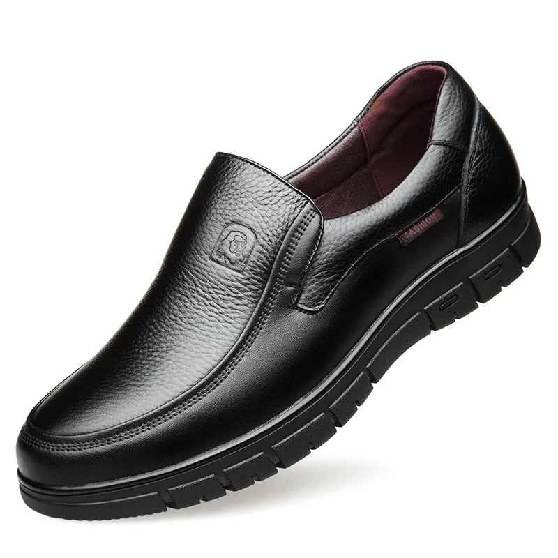 Black leather shoe on a white background
