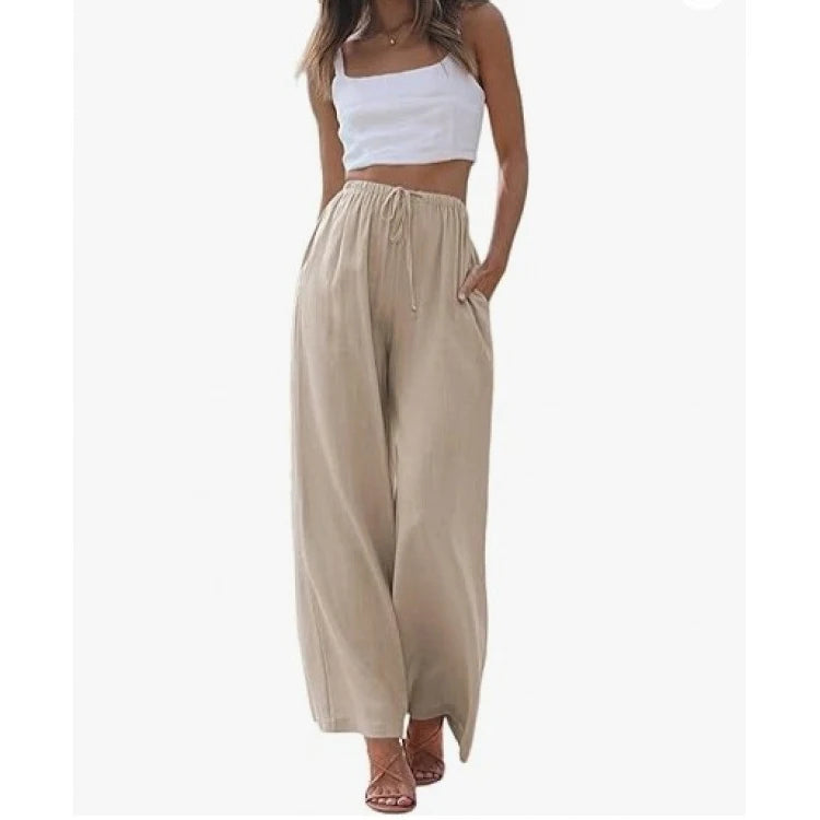Woman wearing a white top and beige wide-leg pants on a white background