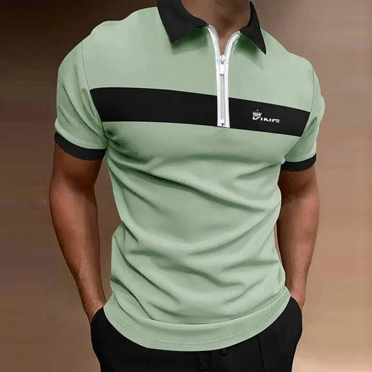 Light green polo shirt with black accents and a brand logo on a blurred background