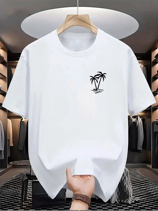 White t-shirt with a palm tree design on a hanger in a clothing store.