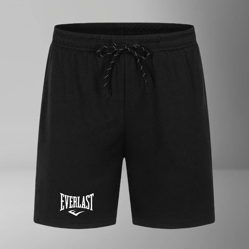 Black shorts with 'Everlast' logo on a gray background