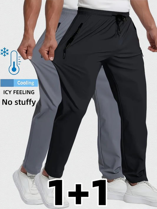 Two pairs of pants, one black and one gray, worn by a person on a white background.
