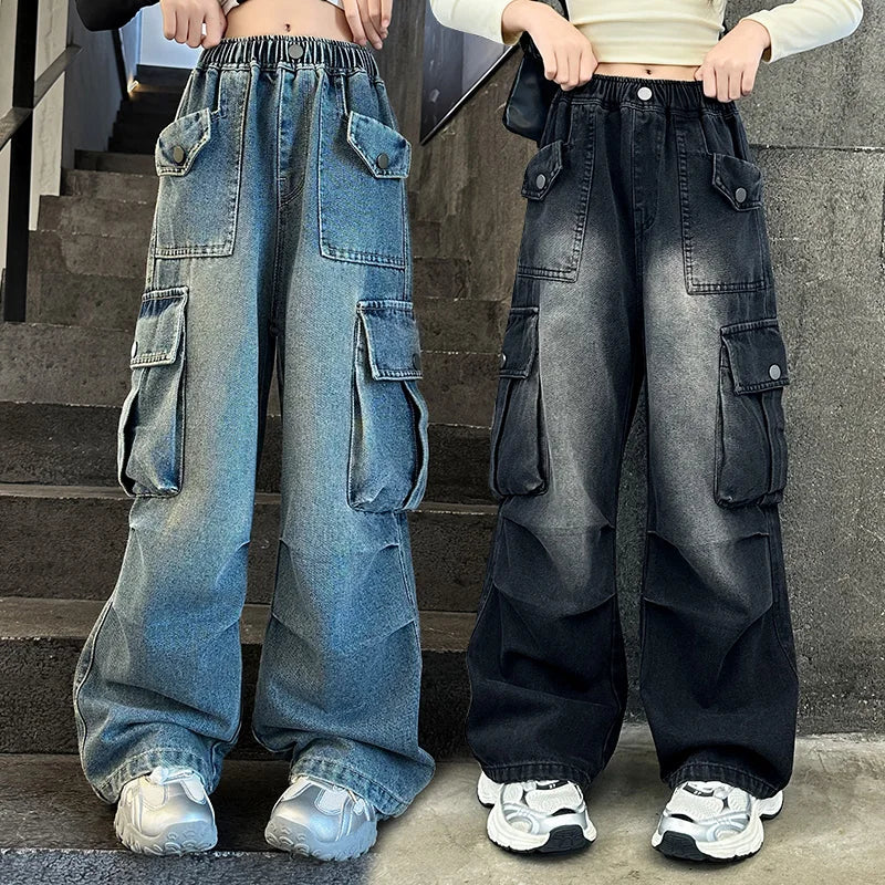 Two pairs of wide-leg cargo pants, one blue and one black, worn by people on a staircase.