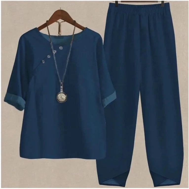 Blue outfit with a top and pants on a beige background